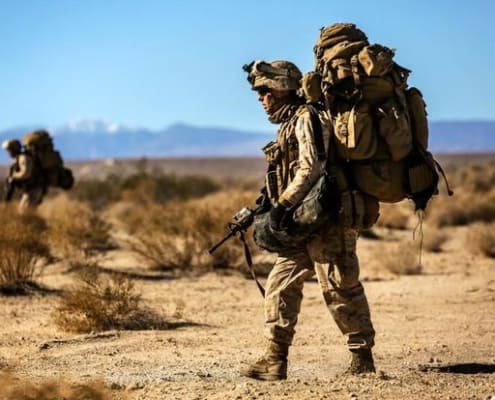 Warfighter Walking with Heavy Backpack and Gear