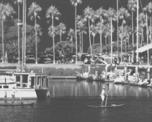 Aetos™ eSWIR (Extended Shortwave Infrared) of boats in harbor and stand up paddle boarder in background